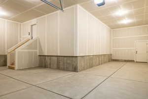 Garage featuring a garage door opener