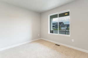 Unfurnished room with carpet floors and baseboards