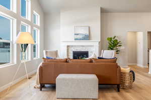 Living room featuring a fireplace and light wood-style flooring