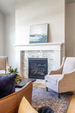 Living area with a fireplace and wood finished floors