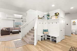Mudroom with recessed lighting, light wood-style floors, and ceiling fan