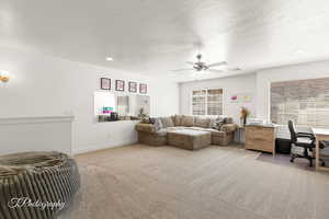 loft featuring light carpet, an office area, ceiling fan, a textured ceiling, and recessed lighting