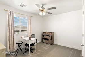 Office featuring light carpet and ceiling fan