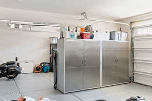 Garage featuring a garage door opener