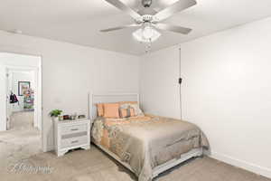 Bedroom featuring carpet and a ceiling fan
