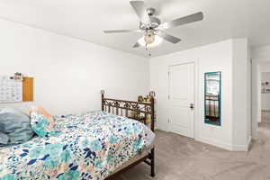 Bedroom featuring carpet flooring and ceiling fan