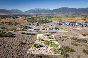 View of mountain backdrop featuring nearby suburban area