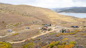 View of property location featuring a water and mountain view