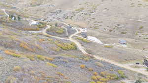 Aerial view of property and surrounding area featuring rural landscape and a desert landscape