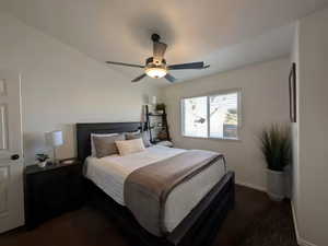 Bedroom with a ceiling fan and baseboards