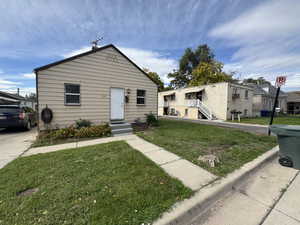 Bungalow-style house featuring a front yard