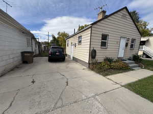 View of side of property featuring a chimney