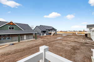View of yard featuring a balcony