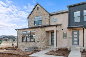 View of front of property featuring stone siding