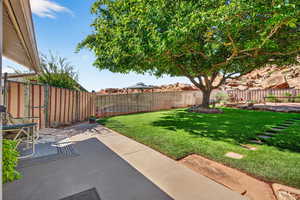 Fenced backyard featuring a patio area