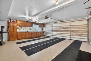 Garage featuring a garage door opener