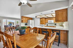 Dining room featuring a ceiling fan and light tile patterned floors