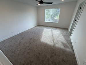 Carpeted empty room featuring recessed lighting and ceiling fan