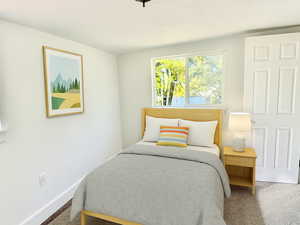 View of carpeted bedroom