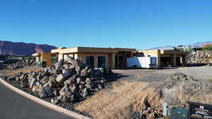 View of front of house featuring a mountain view and stucco siding