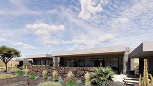 Back of property featuring stucco siding and a patio