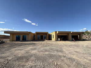 Back of house featuring a garage