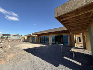 Rear view of property with a patio