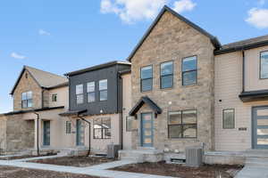 View of front of house featuring stone siding