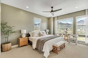 Bedroom featuring carpet floors, a ceiling fan, recessed lighting, and a mountain view