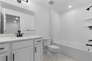 Full bathroom featuring vanity and  shower combination