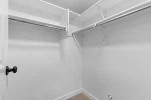 Walk in closet featuring carpet flooring