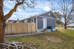 View of property exterior with board and batten siding