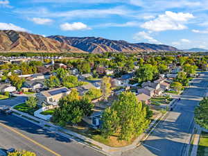Aerial perspective of suburban area with a mountain backdrop