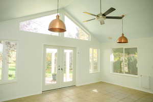 Sunroom with a healthy amount of natural light, and lofted ceiling
