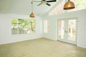Sunroom featuring french doors and lofted ceiling