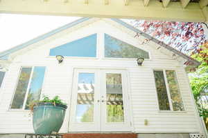 View of home's exterior with french doors