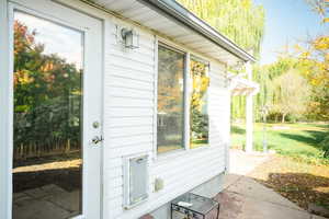 View of side of property featuring a patio area