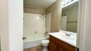 Full bathroom featuring vanity, washtub / shower combination, and light tile patterned floors