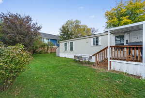 Rear view of property with a wooden deck