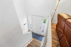 Entryway featuring light wood-style floors and stairway