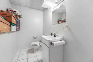 Bathroom with vanity and light tile patterned floors
