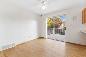 Dining Area with light wood finished floors and a ceiling fan