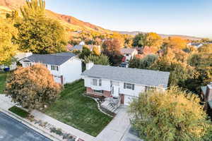 Aerial view of residential area featuring a mountain backdrop
