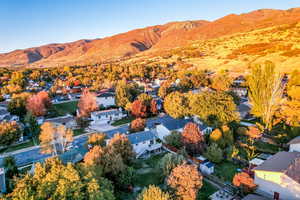 Aerial view of residential area featuring a mountain backdrop