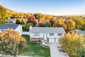 Aerial view of residential area featuring a mountain backdrop