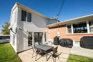 Rear view of house with a patio area