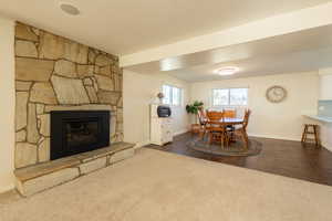 View of dining area from the family room featuring a gas fireplace