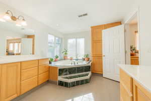 Master bath featuring a large jetted tub, double vanity and walk-in shower.