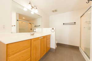 Master bath featuring a large jetted tub, double vanity and walk-in shower.