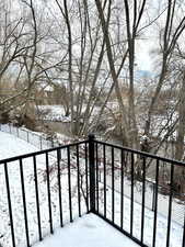 View of snow covered back of property